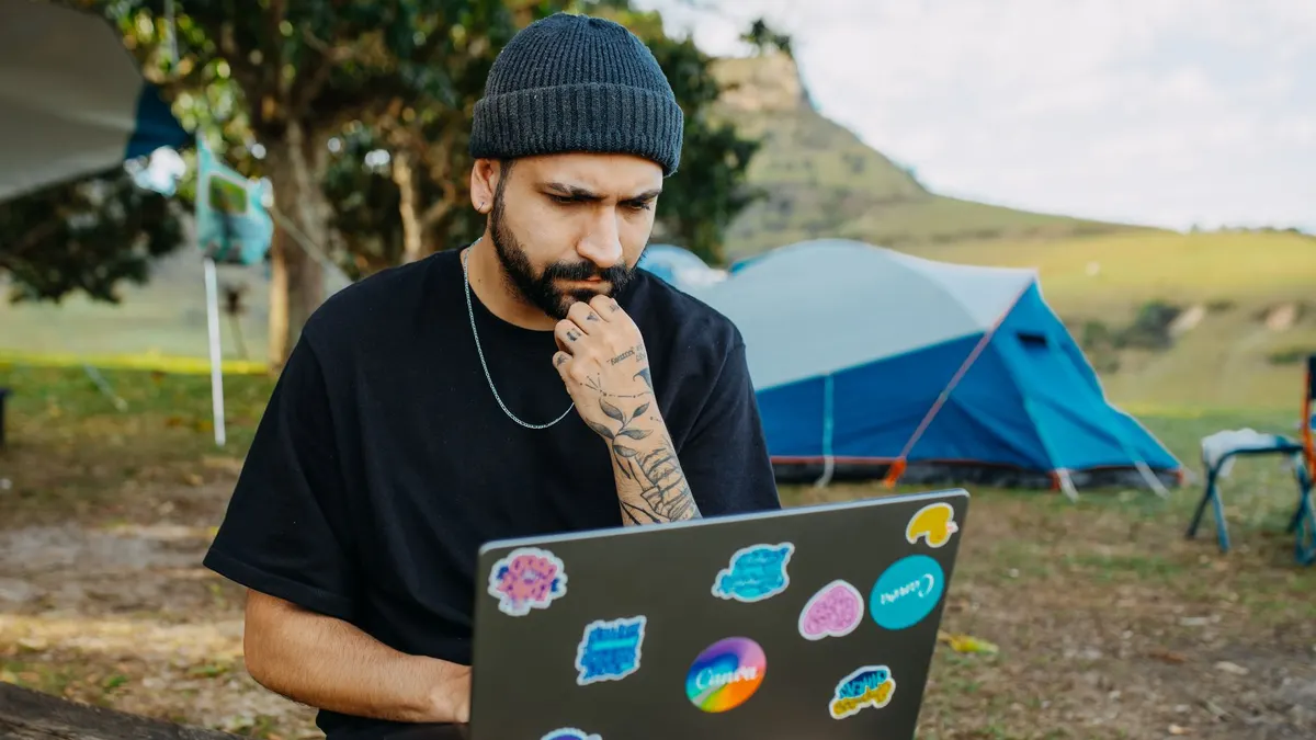 A laptop being used at a remote campsite