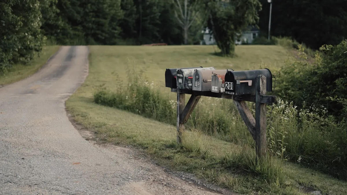 A rural mailbox by a road